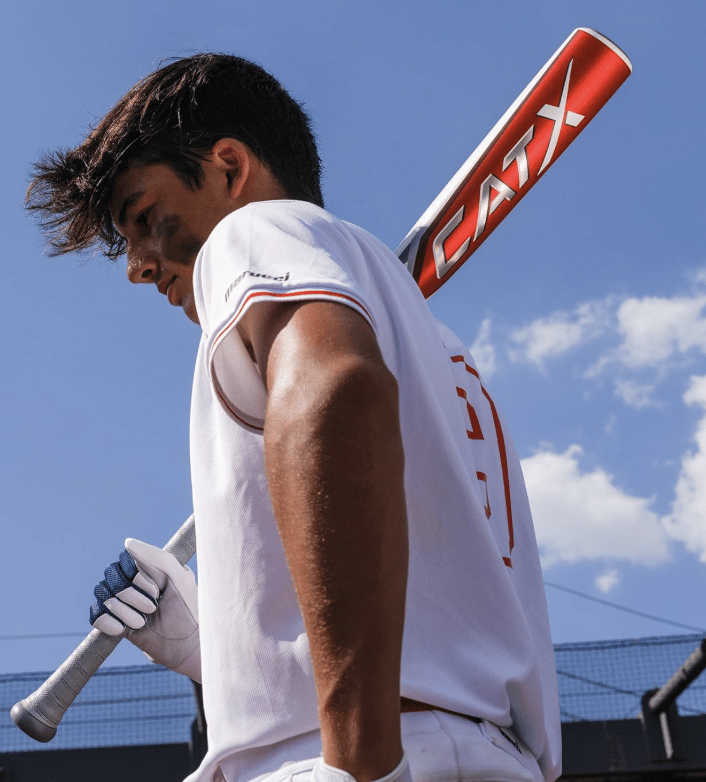 Ball Player carrying baseball bat